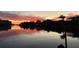 Waterfront community view at sunset featuring the serene harbor and colorful sky reflecting on the water at 5836 Skimmer Point S Blvd, Gulfport, FL 33707