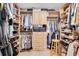 Spacious walk-in closet provides ample storage with shelving, drawers, and hanging space for organization at 5836 Skimmer Point S Blvd, Gulfport, FL 33707