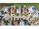 Bird's-eye view showcasing a charming residential street with well-maintained homes, lush landscaping, and private pools at 727 Key Royale Dr, Holmes Beach, FL 34217