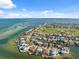 Magnificent aerial panorama of waterfront homes, golf course, bay, and the Gulf of Mexico at 727 Key Royale Dr, Holmes Beach, FL 34217