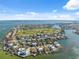 Expansive aerial view of waterfront community with golf course and beautiful homes along the coastline and canals at 727 Key Royale Dr, Holmes Beach, FL 34217
