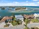Gorgeous waterfront property near a picturesque coastline with boats docked in a clear harbor at 727 Key Royale Dr, Holmes Beach, FL 34217