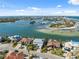 Stunning aerial view of waterfront homes with boat docks and breathtaking bay views at 727 Key Royale Dr, Holmes Beach, FL 34217