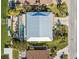 Overhead view of a waterfront home with screened pool, private dock, and meticulously landscaped yard near the water at 727 Key Royale Dr, Holmes Beach, FL 34217