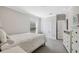 Neutral bedroom features white furnishings, a cozy bed, and a window for natural light at 727 Key Royale Dr, Holmes Beach, FL 34217
