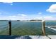 Waterfront view from the private dock with a boat lift overlooking the bay at 727 Key Royale Dr, Holmes Beach, FL 34217