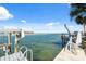 Dock area with boat lift, leading out to the water, perfect for boating enthusiasts at 727 Key Royale Dr, Holmes Beach, FL 34217