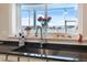 Kitchen sink and window with scenic water views, stainless steel faucet, and counter decor at 727 Key Royale Dr, Holmes Beach, FL 34217