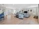 Bright living room featuring hardwood floors, recessed lights, and comfortable seating at 727 Key Royale Dr, Holmes Beach, FL 34217