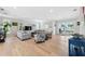 Bright living room featuring hardwood floors, recessed lights, and comfortable seating at 727 Key Royale Dr, Holmes Beach, FL 34217
