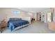 Large bedroom offering a generous space, neutral palette, and balcony access at 727 Key Royale Dr, Holmes Beach, FL 34217