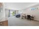 Spacious main bedroom with balcony access, natural light, and a seating area at 727 Key Royale Dr, Holmes Beach, FL 34217