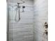 Bathroom features a shower with gray tile and updated shower head at 727 Key Royale Dr, Holmes Beach, FL 34217