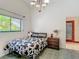 Bright bedroom featuring a cow print bed set, stylish chandelier, and a window view at 8208 Rhanbuoy Rd, Spring Hill, FL 34606