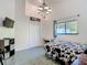Bedroom with vaulted ceiling, chandelier, closet, and a window providing natural light at 8208 Rhanbuoy Rd, Spring Hill, FL 34606