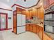Spacious kitchen featuring custom wood cabinetry, granite countertops, and stainless steel appliances at 8208 Rhanbuoy Rd, Spring Hill, FL 34606
