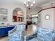 Comfortable living room features blue accents, stylish decor, and easy access to adjacent rooms at 8208 Rhanbuoy Rd, Spring Hill, FL 34606