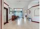 Spacious living room featuring a wet bar and sliding glass doors to the backyard at 8208 Rhanbuoy Rd, Spring Hill, FL 34606