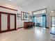 Open-concept living area with tile flooring and a wet bar with seating at 8208 Rhanbuoy Rd, Spring Hill, FL 34606