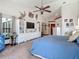 Spacious main bedroom with vaulted ceiling, white dresser and TV at 8208 Rhanbuoy Rd, Spring Hill, FL 34606