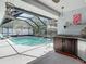 A screened pool with kitchen provides relaxing summer fun at 8208 Rhanbuoy Rd, Spring Hill, FL 34606