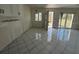 Bright kitchen featuring tiled flooring, white cabinets and a window for natural light at 1001 Inlet Cir # 169, Venice, FL 34285