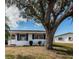 Charming single-story home featuring a well-maintained front yard and blue shutters at 10022 Lily N St # N, Pinellas Park, FL 33782