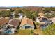 Aerial view of homes with screened pools and mature landscaping in a residential neighborhood at 18605 Le Dauphine Pl, Lutz, FL 33558