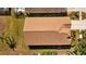 Overhead view of a home's roof with lush landscaping, lawn and hardscape at 18605 Le Dauphine Pl, Lutz, FL 33558