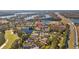 Scenic aerial view of the home near a golf course, lake and highway at 18605 Le Dauphine Pl, Lutz, FL 33558