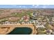 Scenic aerial shot showcasing a residential area near a pond, golf course and major highway at 18605 Le Dauphine Pl, Lutz, FL 33558