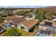 Aerial view of homes with screened pools and landscaping in a residential neighborhood at 18605 Le Dauphine Pl, Lutz, FL 33558