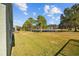 Large backyard overlooking a lake at 18605 Le Dauphine Pl, Lutz, FL 33558