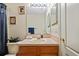 Bathroom with vanity, mirror and lighting, offering a clean and functional space at 18605 Le Dauphine Pl, Lutz, FL 33558