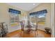 Cozy dining area with backyard and lake views at 18605 Le Dauphine Pl, Lutz, FL 33558