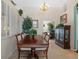 Spacious dining room with large table and chairs, bright natural light, and elegant decor at 18605 Le Dauphine Pl, Lutz, FL 33558