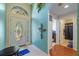 Bright foyer featuring tile flooring, an arched window, and views into other rooms at 18605 Le Dauphine Pl, Lutz, FL 33558