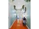 Entry hallway featuring wood floors and a view of the front door and entryway at 18605 Le Dauphine Pl, Lutz, FL 33558