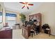Office with desk, bookcase, and comfortable seating, perfect for a productive workspace at 18605 Le Dauphine Pl, Lutz, FL 33558