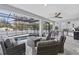 Screened outdoor living area with pool, grill, and comfortable seating at 242 Estado Ne Way, St Petersburg, FL 33704