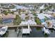 Home with canal access, a private dock, and a serene backyard, perfect for relaxation and waterfront activities at 6446 Lake Sunrise Dr, Apollo Beach, FL 33572