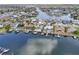 Waterfront home with lush landscaping, private dock, and serene views of the canal and neighborhood at 6446 Lake Sunrise Dr, Apollo Beach, FL 33572