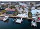 Stunning waterfront home boasts private dock, pool, and outdoor entertaining area with lush tropical landscaping at 6446 Lake Sunrise Dr, Apollo Beach, FL 33572