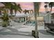 Private backyard oasis with a hammock, pergola, grill, and ample space for relaxation and entertainment at 6446 Lake Sunrise Dr, Apollo Beach, FL 33572