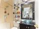 Modern bathroom with a glass bowl sink and a bathtub with shower at 6446 Lake Sunrise Dr, Apollo Beach, FL 33572
