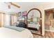 Spacious bedroom with a large mirror, ceiling fan, and curated wall art at 6446 Lake Sunrise Dr, Apollo Beach, FL 33572