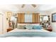 Comfortable bedroom featuring a plush bed with decorative pillows and side tables at 6446 Lake Sunrise Dr, Apollo Beach, FL 33572