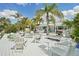 Relax and unwind on this spacious deck with outdoor seating and lush landscaping at 6446 Lake Sunrise Dr, Apollo Beach, FL 33572