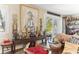 Living room featuring an elegant wall decor, unique furnishings and an access to the patio at 6446 Lake Sunrise Dr, Apollo Beach, FL 33572