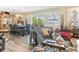 Inviting living room featuring hardwood floors, bright windows, elegant decor and comfortable seating at 6446 Lake Sunrise Dr, Apollo Beach, FL 33572